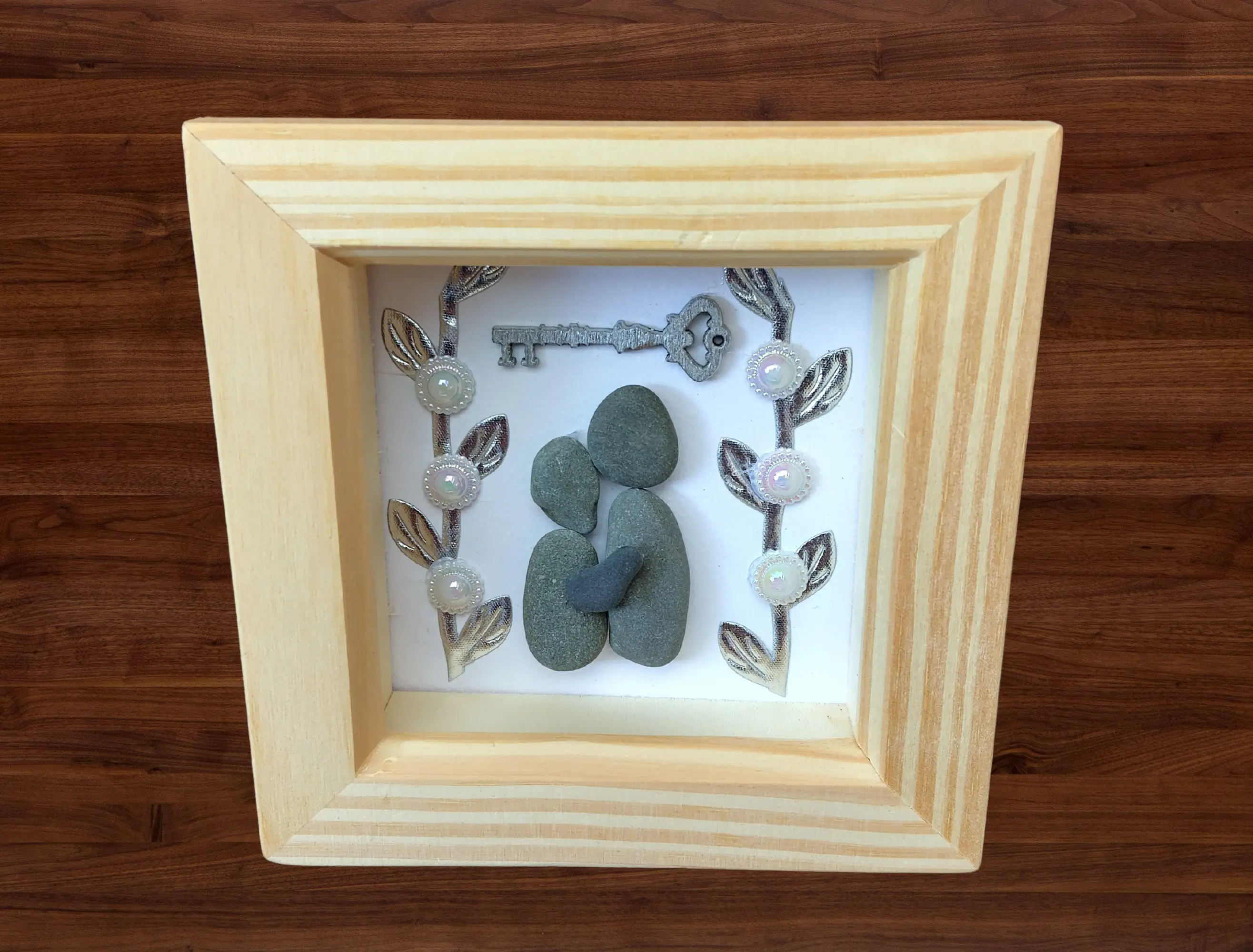 Pebble art frame for a couples new home with key