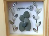 Pebble art frame for a couples new home with key